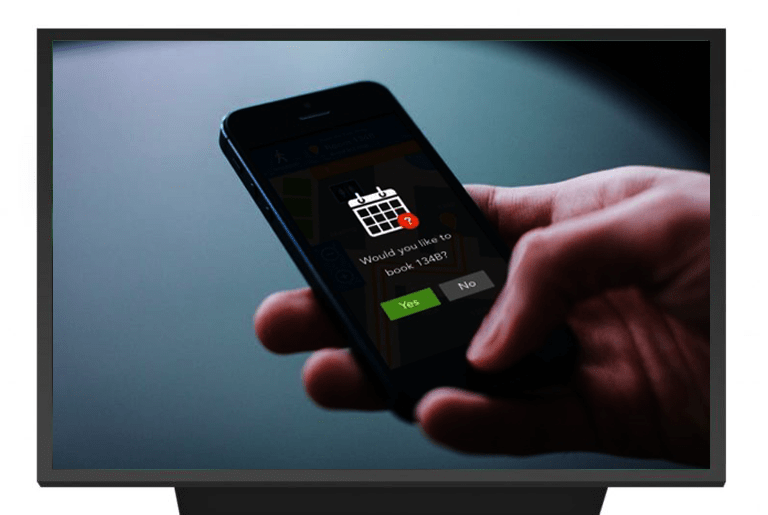 An iphone 5 asking a user if they would like to book an appointment for room 134B
